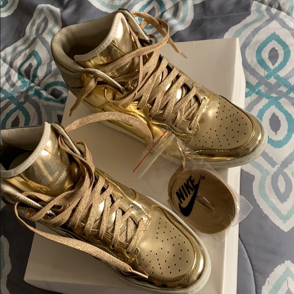 Nike women’s dunks metallic gold